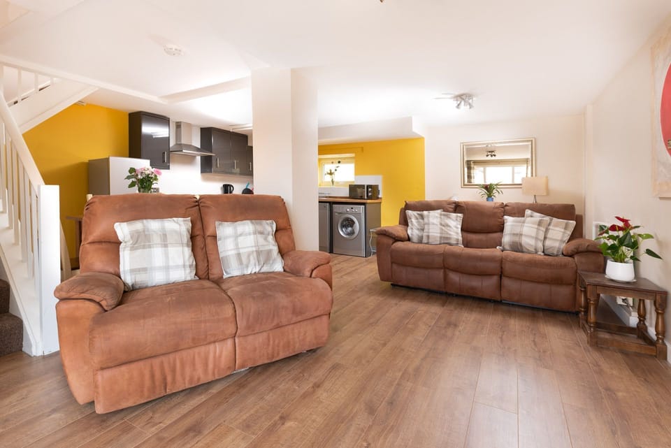 Comfy sofas in living space, plus TV with a DVD player