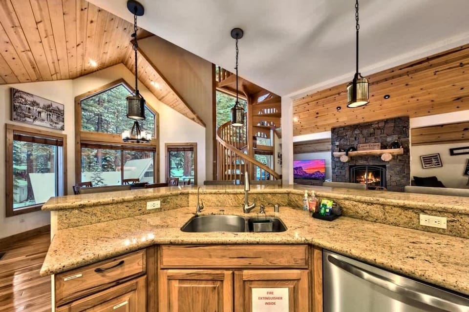 The large island provides additional prep space and a natural spot for guests to gather while meals are being prepared.