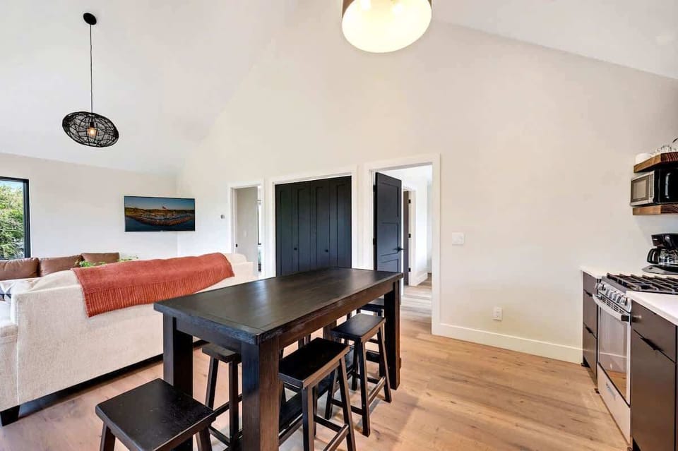 Immerse yourself in the modern furnishings, fast WiFi, and a well-equipped kitchenette, creating a home-away-from-home ambiance. Indulge in the pleasure of savoring a delicious home-cooked meal, or effortlessly transform the space into a functional work area where you can set up shop and focus on your tasks. 