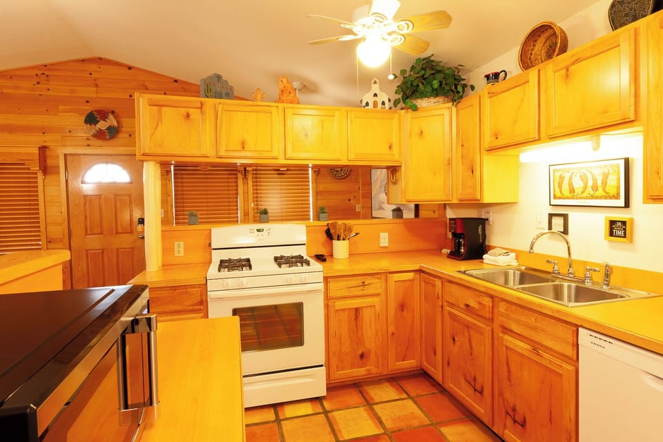 Cook your favorite meals in this cozy kitchen, filled with warm pine wood and everything you need to prepare delicious home-cooked breakfasts or dinners.