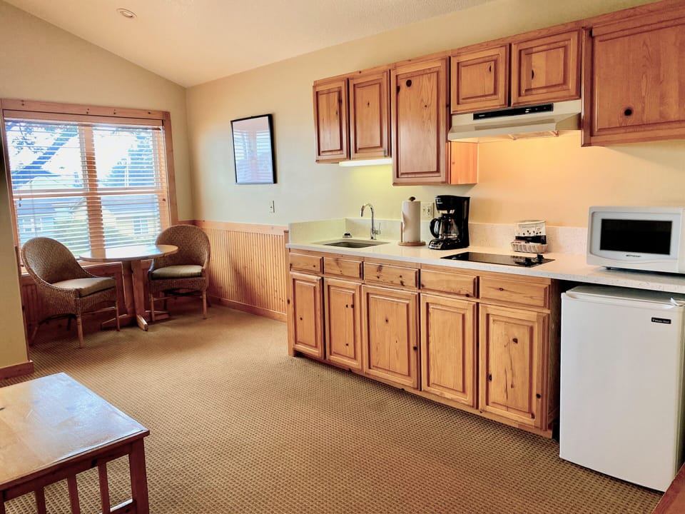 Queen Suite with Sofabed, 2nd Floor, Kitchenette, Pets Allowed with fee | Living area | 50-inch flat-screen TV with cable channels, TV, DVD player