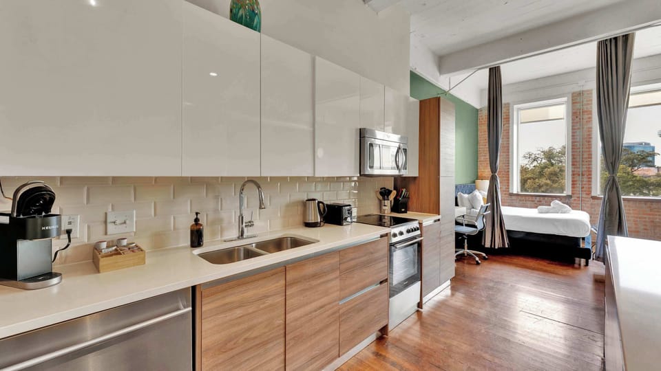 Chic Kitchenette: Whip up meals in style with modern appliances and plenty of natural light!