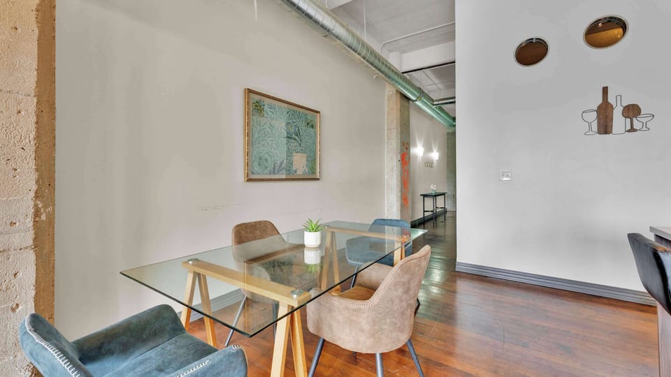 Dining Area: Elevate your meals in a stylish space with chic decor and warm lighting!