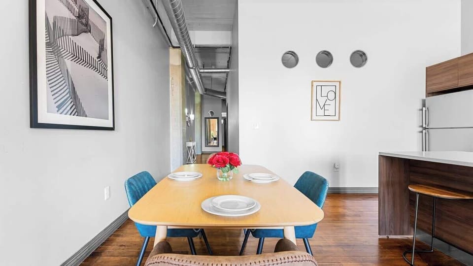 Dining Area: Savor meals together in this stylish space, adorned with art and modern decor!