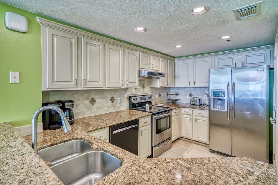 This beautiful upgraded Kitchen has all the comforts of home Florida Style.