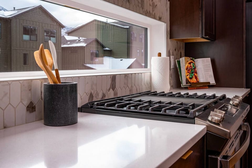 Cook your favorite meals in a kitchen bathed in natural light that enhance the culinary experience.