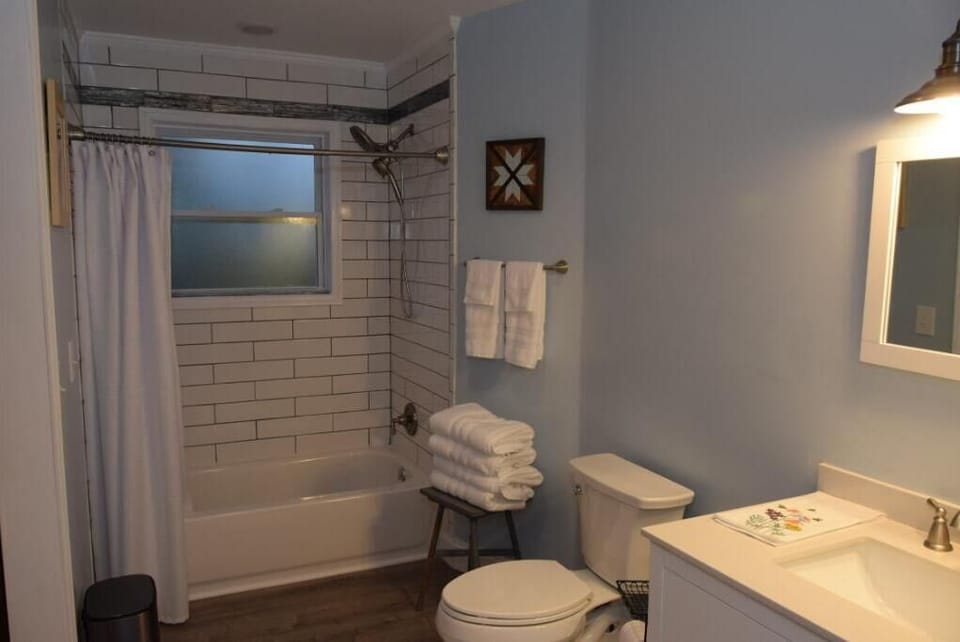 Roomy full bath with custom tile.  Unlimited hot water from tankless heater.