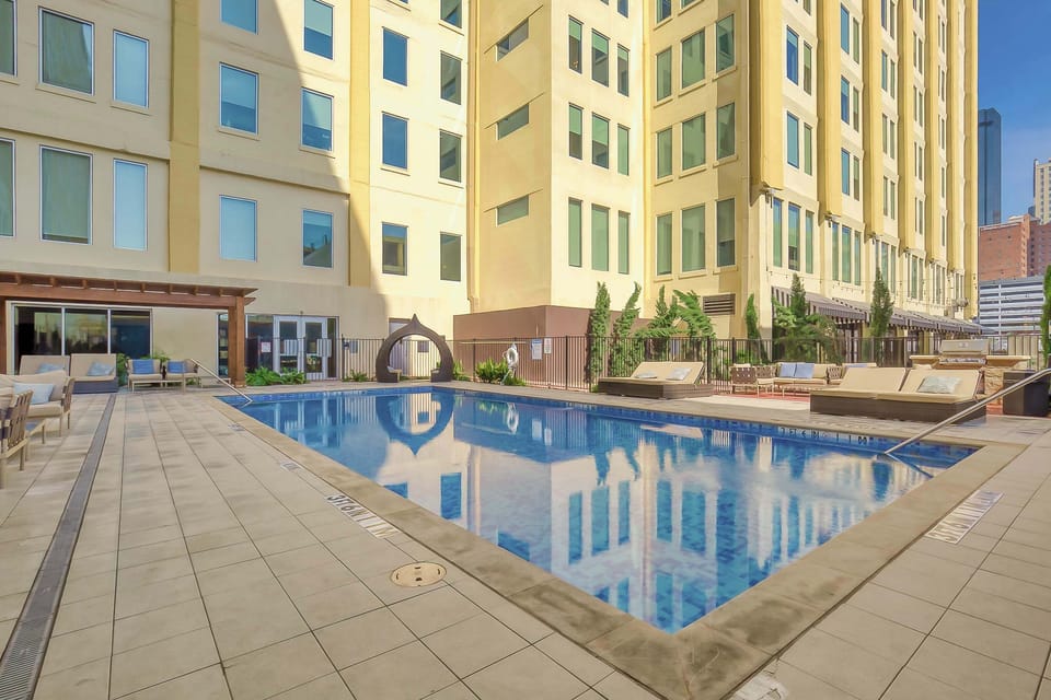Relax by the stunning pool and BBQ Grill while enjoying the vibrant city views.