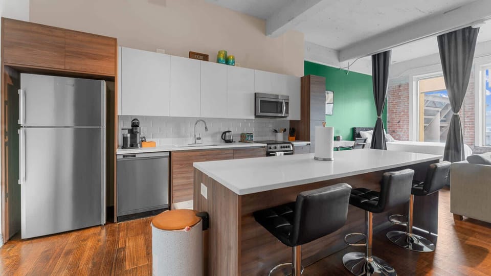 Modern Kitchen: Sleek design meets functionality with a spacious island and stylish seating for gatherings!