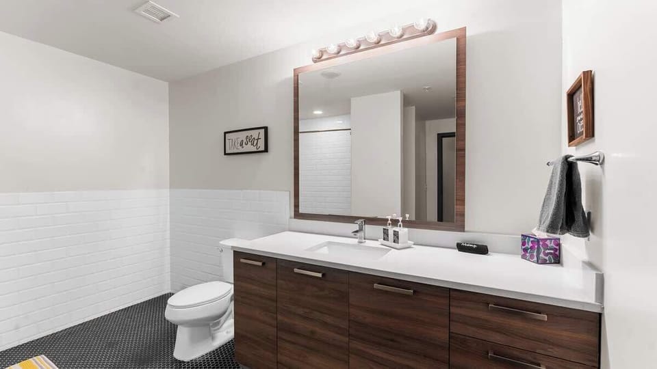  Elegant fixtures and stylish decor await your relaxation in this vibrant retreat.