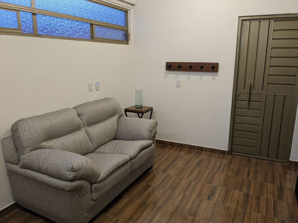 Executive Apartment | Living area | 32-inch Smart TV with digital channels, smart speakers