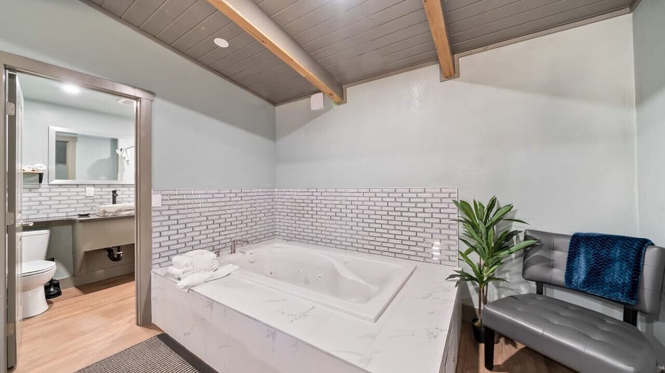 Bath tub across the toilet
