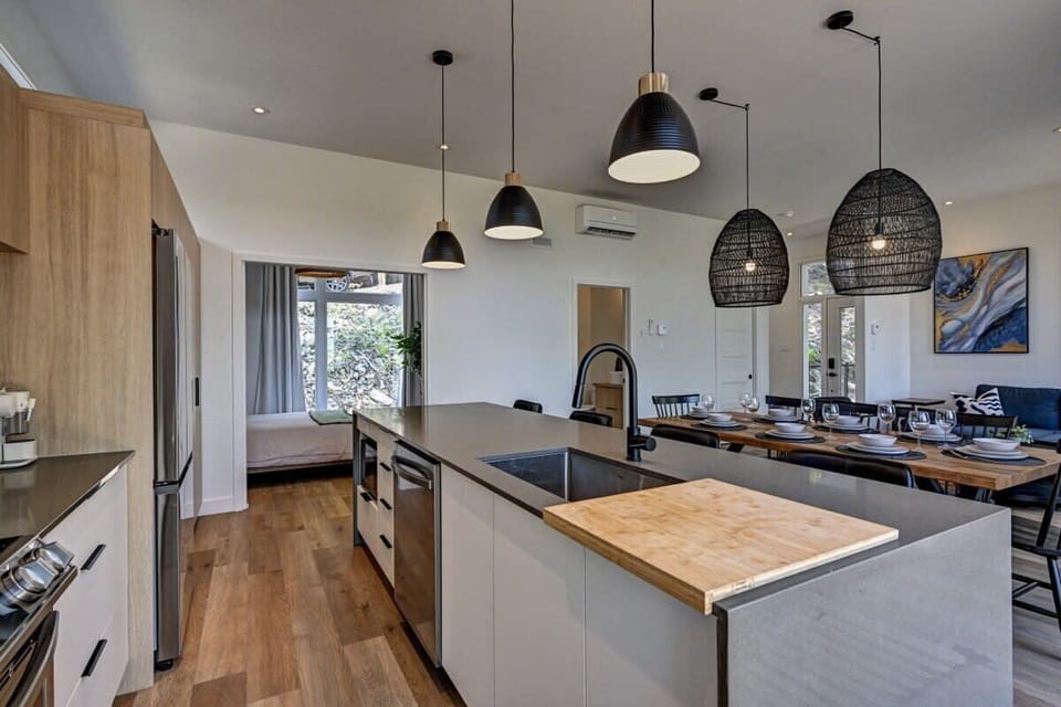 Sleek kitchen with plenty of prep space and modern lighting