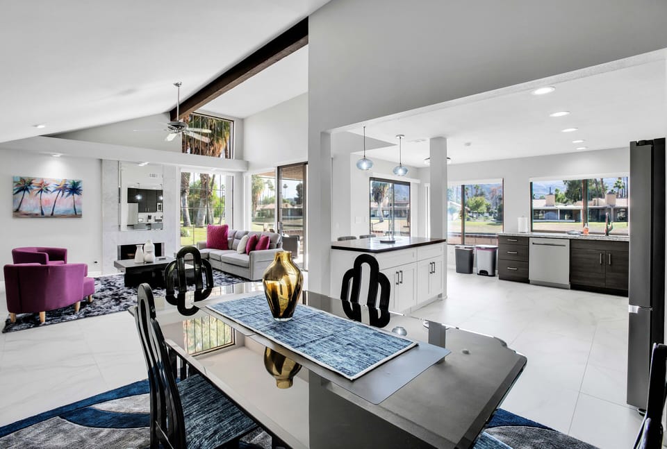 Spacious open-concept living, dining, and kitchen with vaulted ceilings