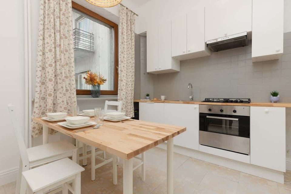 Bright kitchen with cooking utensils. 