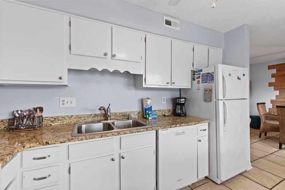 Your fully equipped kitchen features granite countertops, stainless steel appliances, and everything you need to prepare meals during your stay.