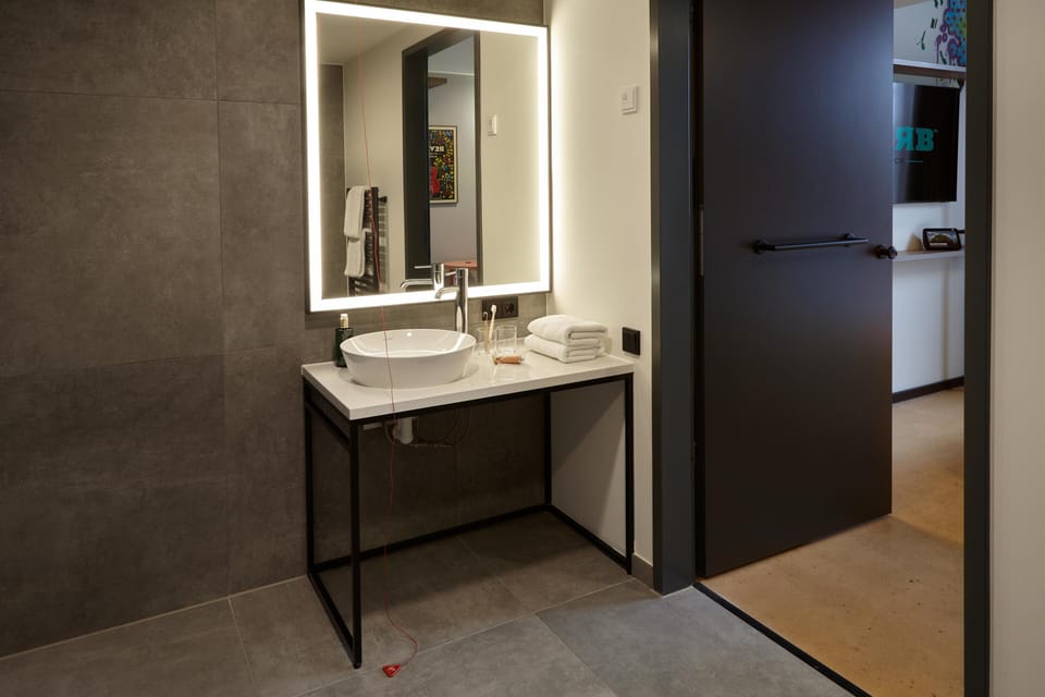 Shower, rainfall showerhead, hair dryer, towels