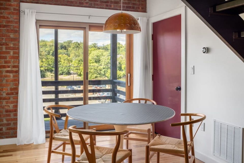 Enjoy your morning coffee or a meal with scenic views from the dining area, which opens up to a private outdoor deck.