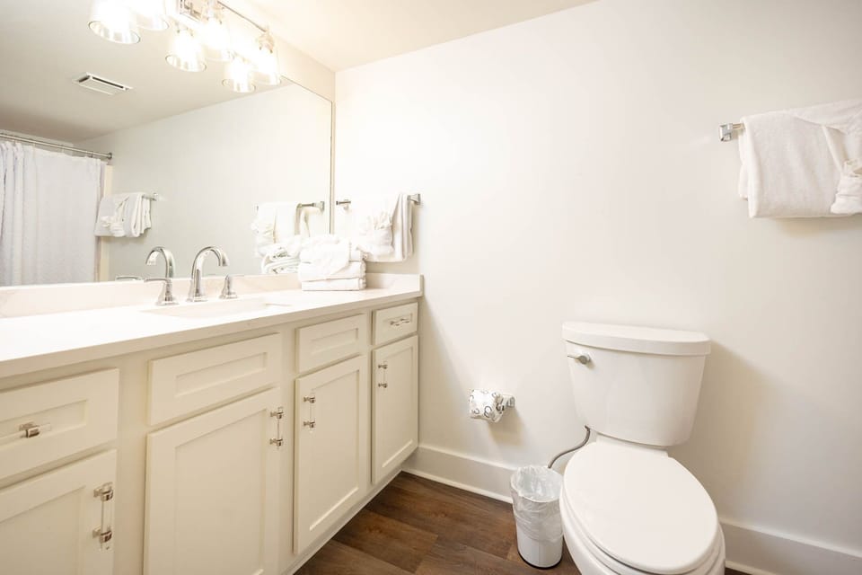 Refresh in this guest bathroom featuring a spacious vanity and fresh towels