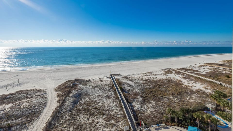 Take in the expansive views of the tranquil waters and shoreline from your balcony