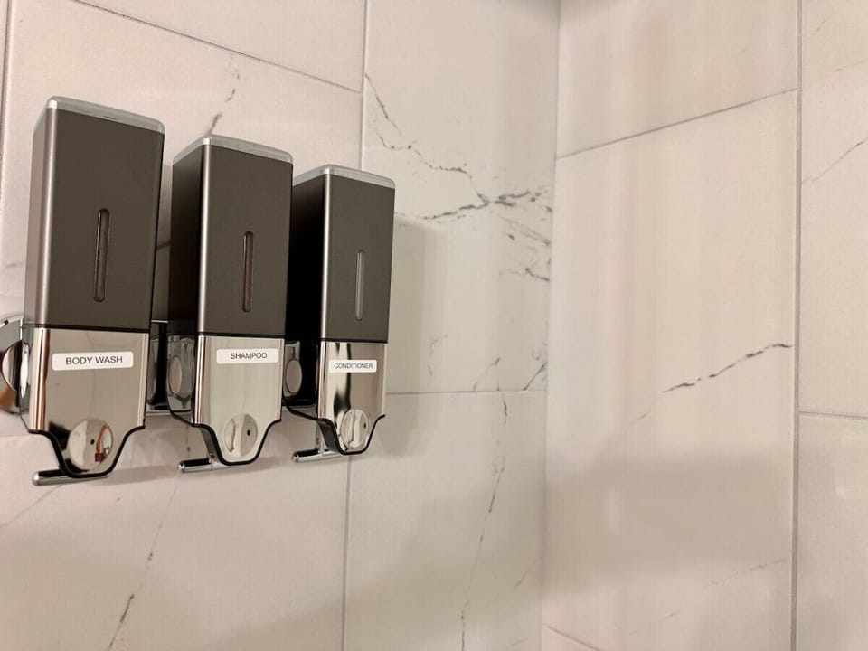 Family-friendly bathrooms, equipped with essential wash products.