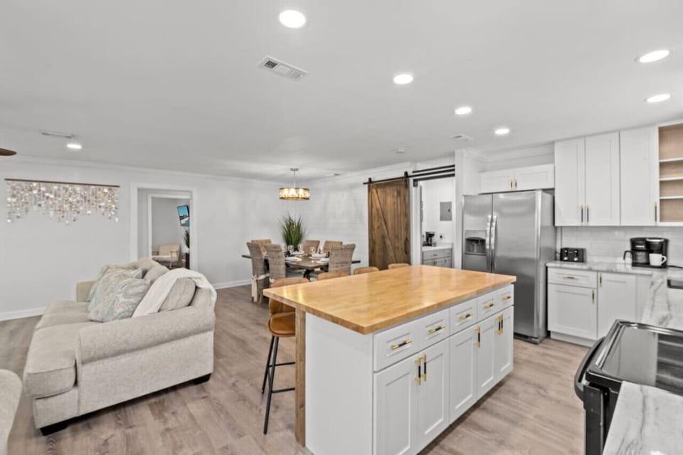 Our open floor plan connects the kitchen, living room, and dining area, ensuring seamless enjoyment throughout your stay!