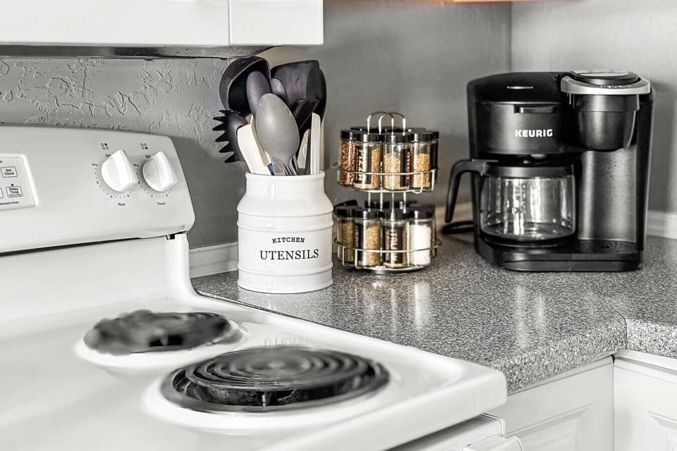 Curated coffee bar and kitchen essentials at Cozy Great Falls Retreat.