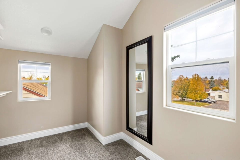 Open Bonus Space Featuring Vaulted Ceilings and Montana Views