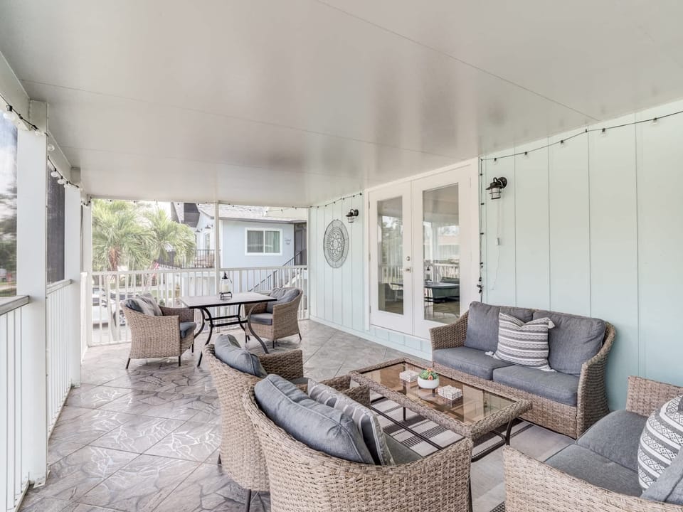 Screen porch offers serene neighborhood views