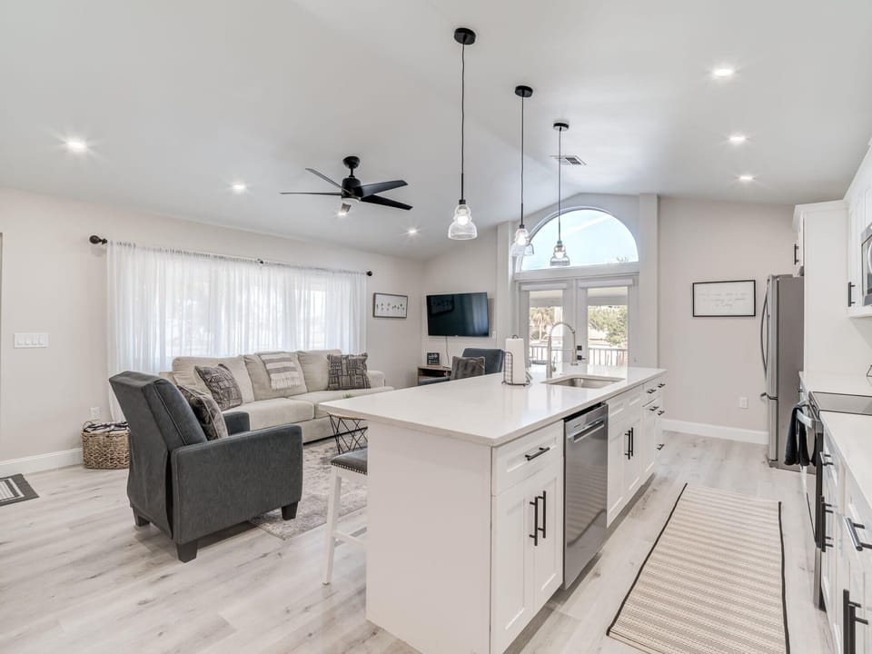 Open kitchen with counter height seating at the bar