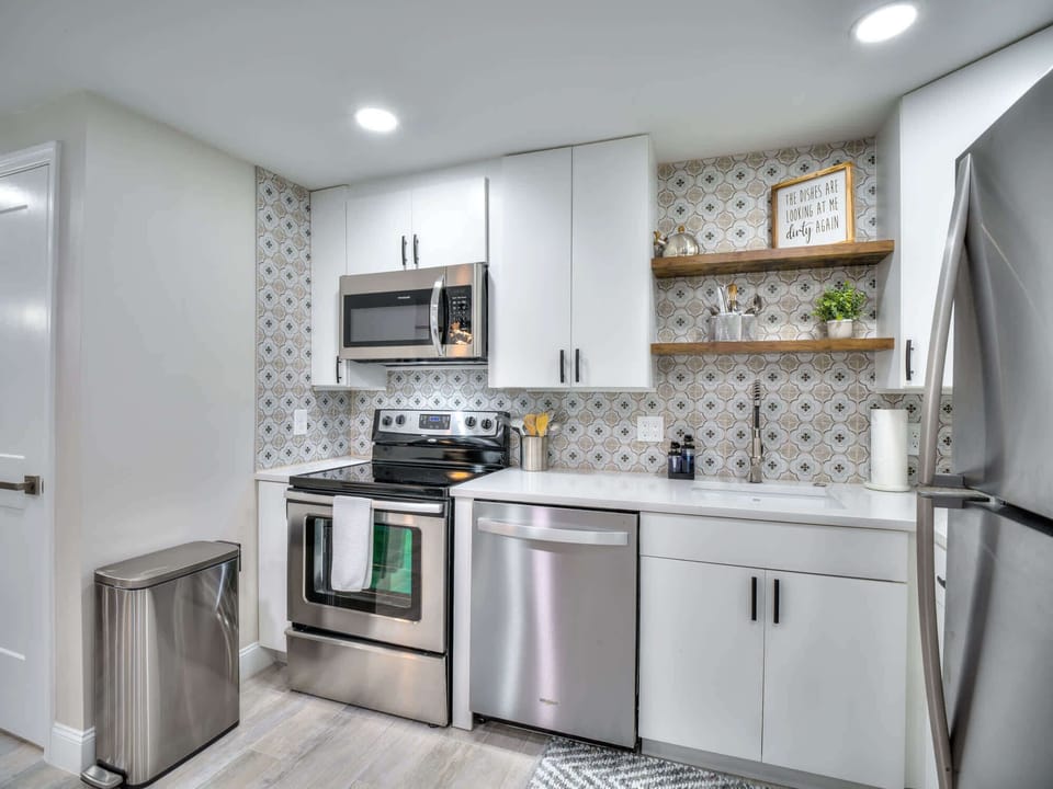 Newly redone kitchen. dishwasher, range, microwave, full size refrigerator and disposal.