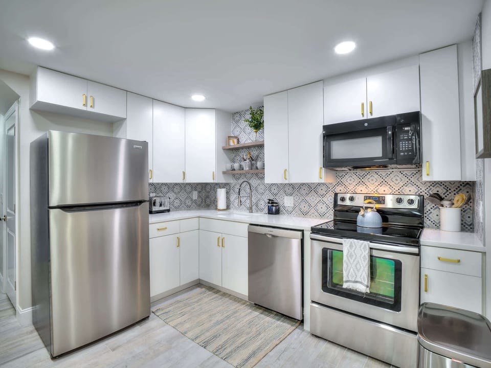 Kitchen has plenty of cookware and dishes for a comfortable stay