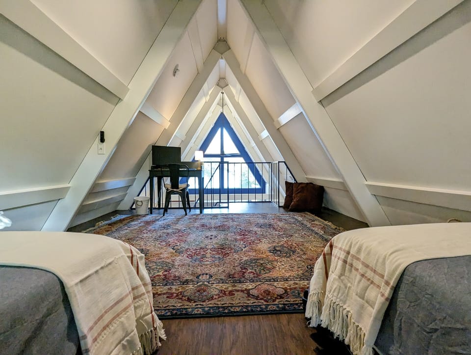 Upstairs loft looks out to the lake and has a designated work space.