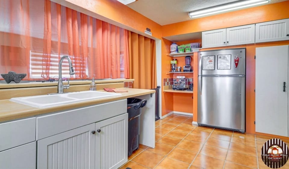 The kitchen sink has a sensor on the side to turn it on. But you'll still ask!