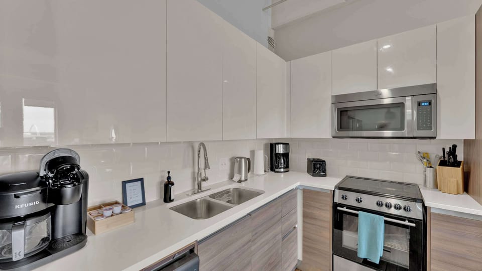 Kitchen Bliss: Sleek modern appliances and generous counter space await your culinary creations!
