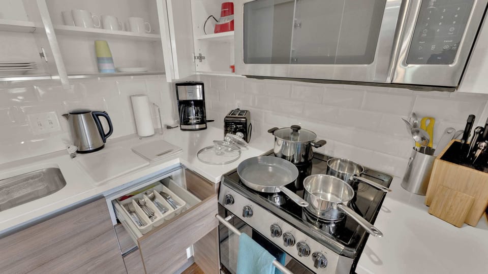 Stylish Kitchen: Whip up delicious meals in this modern kitchen, fully equipped for culinary adventures!
