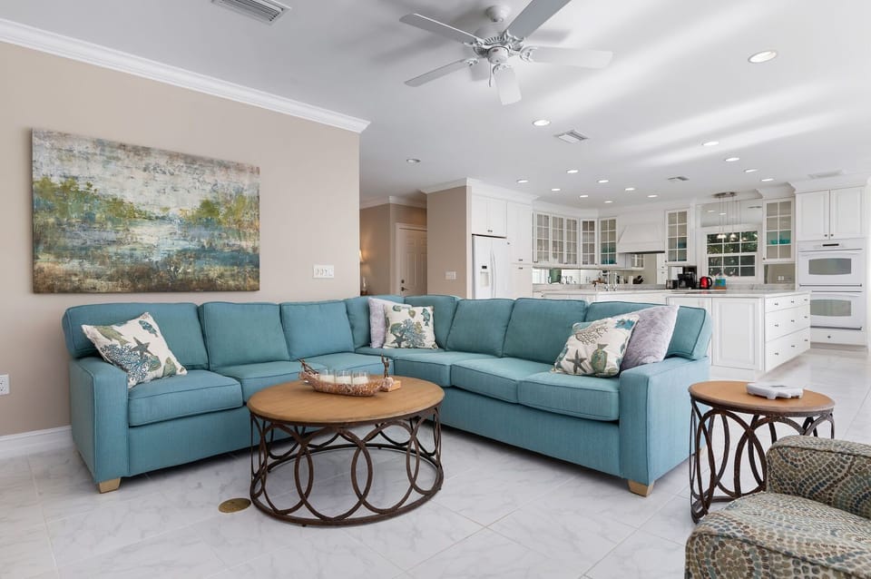 Modern large sectional, L-shaped around circular coffee table