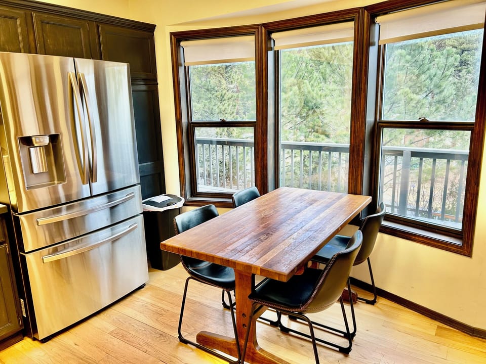 Kitchen table with tree-filled view!