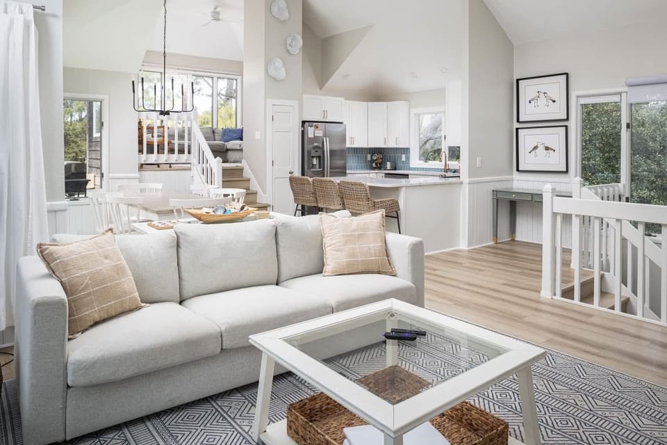 Open-concept living and dining area featuring a view of the elevated Eagle's Nest nook