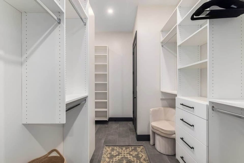 Walk in closet with pass through to laundry