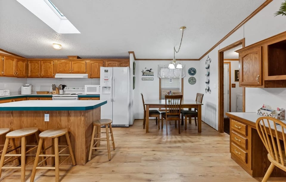 Kitchen in the main home, with breakfast nook & island seating