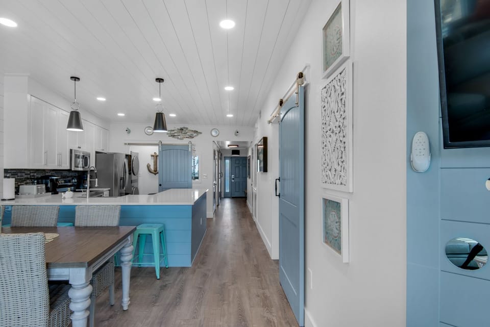 Your spacious coastal kitchen flows seamlessly into the main living area, perfect for cooking family meals together.