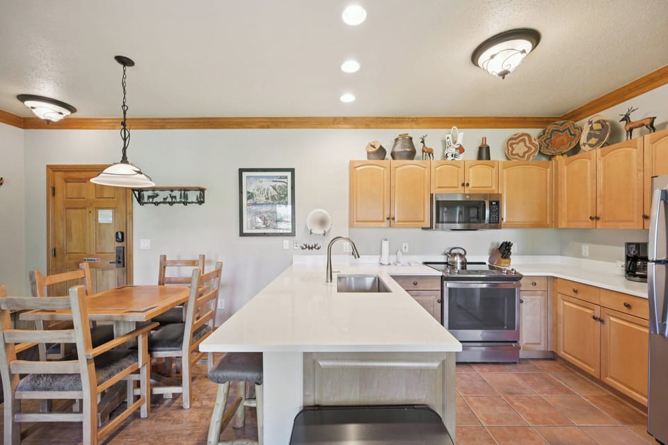 Cook memorable meals in your spacious kitchen featuring warm wood cabinets, granite countertops, and a large island perfect for gathering.