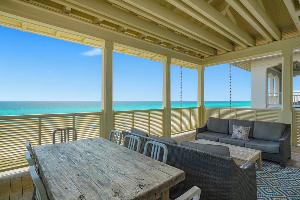THIRD FLOOR FRONT BALCONY WITH DINING AND SEATING OVERLOOKING T