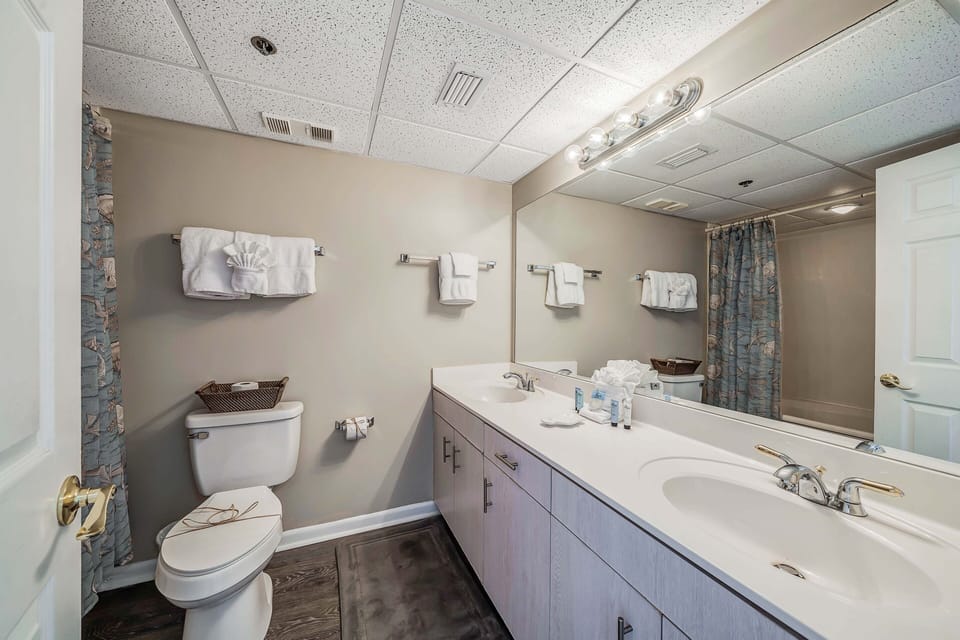 The second full bathroom also has double sinks.