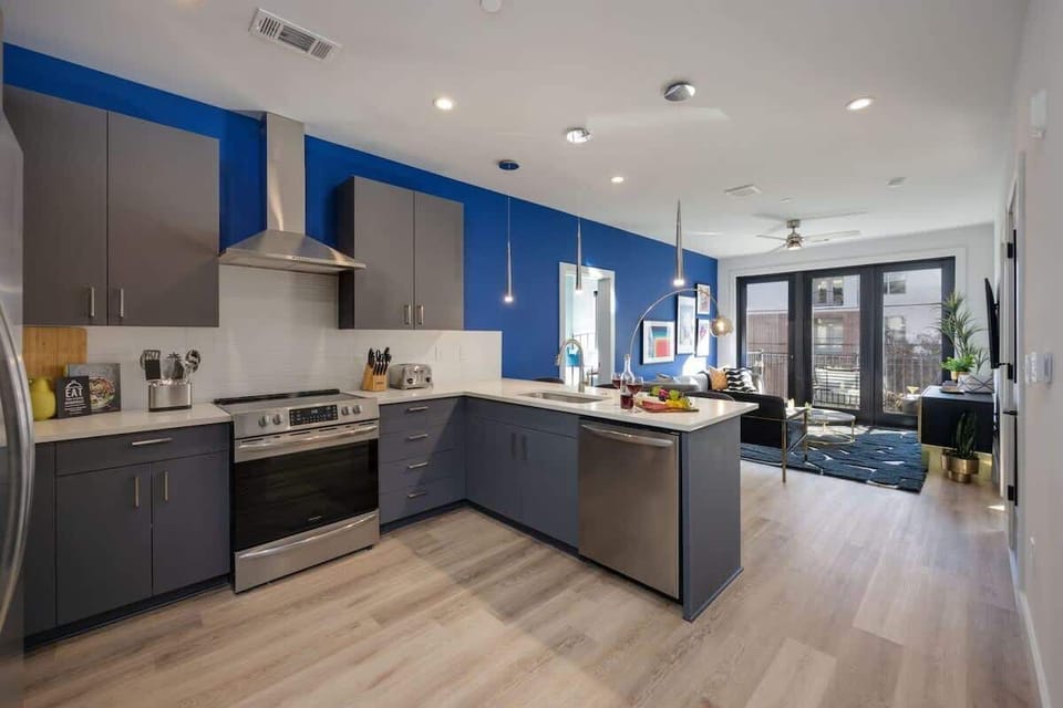 Fully equipped kitchen stocked with your basic cooking essentials, stainless-steel appliances, and breakfast bar seating.