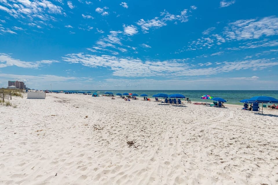 Make it a beach day on the soft sand with easy beach access and colorful umbrellas for a perfect day by the water