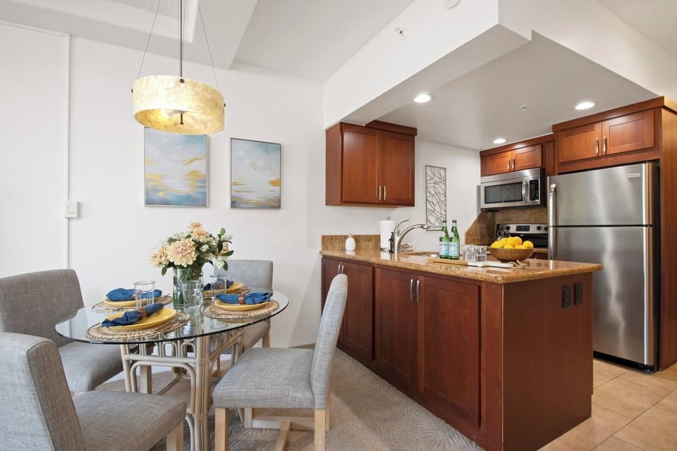 Tuck into laughter and late bites at this polished table, where soft hues and warm wood create dining daydreams