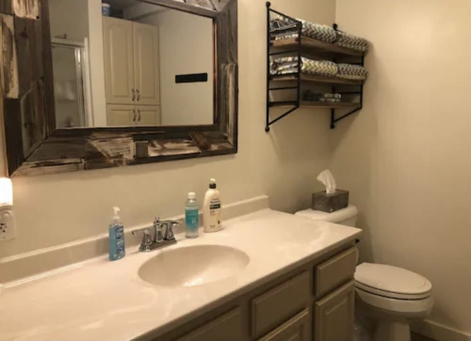 Full bathroom with walk in shower.   No tub