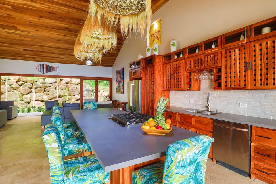 Custom kitchen with new cabinets, countertops, backsplash, seating, lighting
